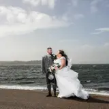 couple enjoying ayrshire wedding package on beach