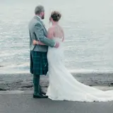 newly married couple on largs beach in ayrshire outside brisbane house